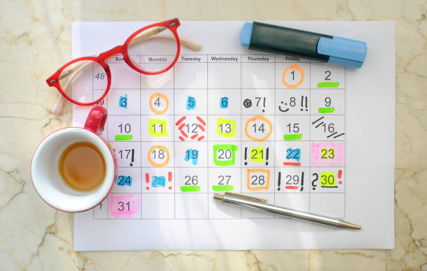 Planner and notebook on a desk for daily scheduling
